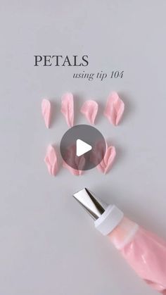 a pink object is being used to make it look like petals