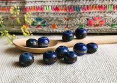 A set of 10 ethnic Yak horn beads (tinted blue) coming directly from Nepal. These are made entirely by hand and are inlaid with Turquoise and brass wire. They are very original. In Nepal they are often used for making necklaces or bracelets. They will be used for all types of creations. Sold by: Lot of 10 pearls Size available: 8mm or 10mm Shipping will be careful and fast! Visit the Nepalmashop.fr store for more choices in ethnic beads and jewelry! Namaste! Blue Wooden Beads For Festival, Traditional Turquoise Wooden Beads, Artisan Blue Wooden Beads, Traditional Blue Jewelry With Wooden Beads, Blue Wooden Beads For Jewelry Making, Blue Polished Bohemian Beads, Traditional Blue Wooden Beads, Artisan Blue Polished Beads, Artisan Wooden Beads For Festivals