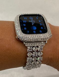 This Silver Apple Watch band or Apple Watch Case is compatible with all Apple Watch Series (2-9 SE), including 38mm, 40mm, 41mm, 42mm, 44mm, 45mm, and Ultra 49mm models. Products are designed by Iwatch Candy and made custom to our specifications. Add a touch of glamour and sophistication to your Apple Watch with our stunning jewelry style watch bands and apple watch cases. Perfect for everyday wear or special occasions, they feature sparkling high quality crystals or lab created diamonds. These Apple Watch Cover, Apple Watch Band Women, Watch Bands Women, Custom Apple Watch Bands, Diamond Grillz, Mens Bling, Apple Watch Bands Fashion, Apple Watch Bands Women, Apple Watch Fashion