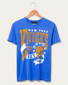 Women's Knicks Banner Vintage Tee | Junk Food Clothing Throwback Sports Season Tops With Relaxed Fit, Throwback Graphic Print Top For Game Day, Retro Cotton T-shirt With Team Logo, Throwback Sports T-shirt With Relaxed Fit, Throwback Relaxed Fit T-shirt For Sports, Throwback T-shirt With Team Logo, Vintage Graphic Print T-shirt For Game Day, Retro Cotton Tops With Team Logo, Retro Cotton Top With Team Logo