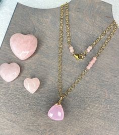 "This brand new Rose Quartz necklace boasts a stunning puffy teardrop pendant that is faceted and has a beautiful pink color. Petite rose quartz, faceted beads have been hand wire wrapped throughout the necklace to add charming detail. Necklace measures 19\" with an additional 2\" extender chain.   Total necklace length with extender is 21\". Pink color tones vary in the different beads. This is due to the natural element of the gemstones. All gold is 14 karat gold filled. This includes the chai Bead Bar Necklace, Bead Bar, Tigers Eye Necklace, Rose Quartz Necklace, Teardrop Pendant, Quartz Rose, Quartz Necklace, Eye Necklace, Boho Bracelets