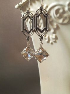 These Art Deco style vintage glass dangles are the perfect earrings for a Great Gatsby themed wedding. They were inspired by the dazzling diamond Victorian Style Party Chandelier Earrings, Victorian Chandelier Dangle Earrings For Party, Victorian Dangle Chandelier Earrings For Parties, Art Deco Clip-on Earrings For Formal Occasions, Art Deco Formal Clip-on Earrings, Art Deco Clip-on Jewelry For Formal Occasions, Formal Art Deco Clip-on Jewelry, Clip-on Art Deco Jewelry For Formal Occasions, Victorian Dangle Earrings For Party