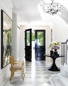 the foyer is decorated in black and white