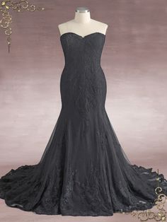 a black dress is on display in front of a mannequin headdress