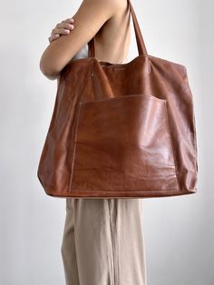 Maggie Tote - Oversized Tan Italia Leather Handbag - Streets Ahead Large Brown Shoulder Bag With Dust Bag, Leather Pouch Bag With Pockets, Modern Brown Bag With Pockets, Large Brown Travel Bag, Brown Hobo Bag With Pockets For Shopping, Brown Tote Travel Bag With Dust Bag, Chic Brown Bags With Pockets, Chic Brown Bag With Pockets, Luxury Large Shoulder Bag For Everyday Use