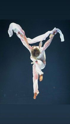 a person doing a handstand in the air