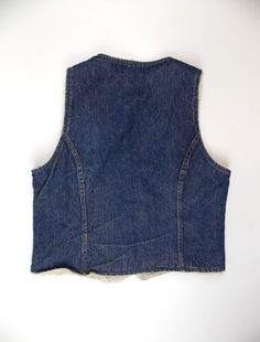 "Vintage 1980's denim vest with faux shearling lining. Snap closure and two small pockets at front. Good vintage condition. Size tag is faded. Please refer to the following measurements when considering fit. Length 23\" Chest 38\" Please note that vintage clothing and contemporary sizes can vary greatly. We take measurements of listed garments by laying the garment flat and then doubling the measurement. When considering whether a garment would fit, we suggest taking a similar garment from your Cheap Y2k Denim Vest, 1990s Photos, Lavender Bags, Mens Vests, Vest White, Zig Zag Pattern, White Mesh, Denim Vest, Hot Springs