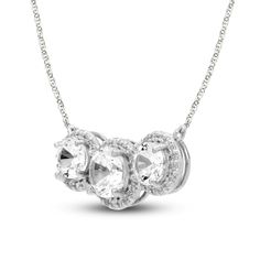 This beautiful necklace endearingly symbolizes past, present and future love. A trio of sparkling round-cut white lab-created sapphires shines even brighter when embraced by more white lab-created sapphires. The shimmering center rests amidst a 17.25-inch rope chain that secures with a spring-ring clasp. White Gold Necklaces With Center Stone For Anniversary, White Sparkling Stones Round Cut Necklace, White Necklaces With Sparkling Round Cut Stones, White Round Cut Necklaces With Sparkling Stones, Anniversary Cubic Zirconia Necklace With Center Stone, Anniversary Necklace With Round Center Stone, Fine Jewelry Anniversary Necklace With Center Stone, Silver Three Stone Diamond Necklace, Fine Jewelry Necklace With Center Stone For Anniversary