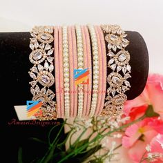 Pink Bangle Set With Rose Gold American Diamond Kadas. Shipped FREE from Canada to USA, Europe, Italy, Norway, Spain and everywhere else. 📦 Unmatched FREE Worldwide Shipping Explore more INDIAN BANGLES, Indian Kada, CHURA, Bridal Kada 👉 PUNJABI BRIDAL JEWELLERY ONLINE 🛒 AMERICAN DIAMOND JEWELRY Pushpinder, Canada ⭐️⭐️⭐️⭐️⭐️ Amazel Designs products are beyond the expectations 😇Just awesome like them. I ordered couple of things for my wife. Thanks for the quick and fast delivery 😊 Aisha, Cana Pink Beaded Bangle Bracelets For Wedding, Elegant Pink Beaded Bracelets For Festive Occasions, Adjustable Pink Gold Wedding Bracelets, Adjustable Pink Gold Bracelets For Wedding, Adjustable Pink Gold Wedding Bracelet, Rose Gold Beaded Bangle Bracelets For Wedding, Bridal Jewellery Online, Indian Bangles, Europe Italy