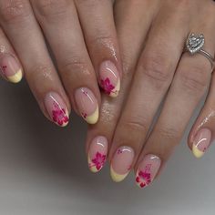 These nails showcase a delightful summer vibe with their soft yellow French tips and vibrant pink hibiscus flower accents. Perfect for beach days and sunny getaways, these nails bring the essence of tropical blooms to your fingertips.  🌸Click on the image to shop our trending Korean Gel Polish this season.  🌸Credit: lakayla.thenailfaerie on Instagram 🌸summer nails, yellow French tips, pink hibiscus nails, tropical nail art, beach nails, summer gel polish, Korean nail trends, floral nail design, vibrant summer nails, tropical bloom nails, summer manicure ideas, hibiscus nail art, trendy summer nails, gel polish designs, summer nail inspiration, beach-ready nails, bright summer nails, tropical flower nails, summer nail colors, summer nail trends. Vacation Biab Nails, French Tip Almond Nails With Flowers, Vacay Nails Almond, Summer Vacay Nails, Kutek Disney, Milky Nails, Tropical Nails, Girly Acrylic Nails