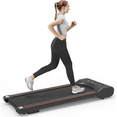 a woman running on a treadmill