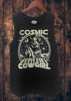 "Cosmic Cowgirl muscle tank top Quiet, humble tank letting everyone know, I'm a Lake Babe * Size S: Length measures 25\" from shoulder to hem with a 14\" bust * Size M: Length measures 26.5\" from shoulder to hem with a 15\" bust  * Size L: Length measures 27\" from shoulder to hem with a 16\" bust  * Size XL- Length measures 28\" from should to hem with 17 inch bust * Runs true to size A feminine version of the muscle tank, this womens flowy scoop neck tank top is a must-have style, designed with our exceptionally soft poly-viscose fabrication that softly drapes around curves. The modern elongated armholes and curved bottom hem make it perfect for layering. Offered in a variety of solid and marble colors. Features: Sideseamed. Relaxed, drapey fit. Low cut armhole. Curved bottom hem." Fitted Sleeveless Grunge T-shirt, Fitted Graphic Tank Top For Streetwear, Cotton Sleeveless Muscle Tee With Screen Print, Cotton Screen Print Sleeveless Muscle Tee, Fitted Sleeveless Graphic Print T-shirt, Fitted Cotton Muscle Tee With Graphic Print, Fitted Muscle Tee With Letter Print For Summer, Fitted Summer Muscle Tee With Letter Print, Retro Graphic Print Sleeveless Tank Top