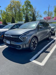 an suv parked in a parking lot with other cars