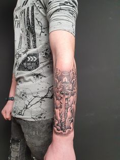 a man with a tattoo on his arm