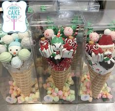 two ice cream cones filled with candy and candies