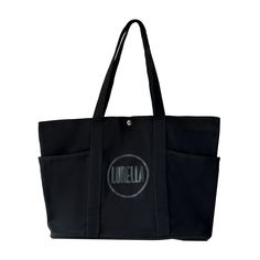 Be prepared for any adventure with our Can Hold It All Tote! This stylish and spacious tote has you covered, keeping everything you need in one place. Say goodbye to digging for your essentials and hello to convenience and organization. Perfect for the on-the-go lifestyle. Practical Weekender Tote Bag With Pockets, Versatile Black Canvas Bag For Daily Use, Black Travel Canvas Bag With Removable Pouch, Black Canvas Travel Bag With Removable Pouch, Black Canvas Bag With Removable Pouch For Travel, Large Capacity Black Canvas Bag For On-the-go, Black Canvas Bag With Removable Pouch For On-the-go, Large Black Bag With Top Carry Handle, Black Canvas Bag With Pockets For On-the-go