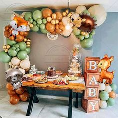 a baby shower party with balloons and decorations