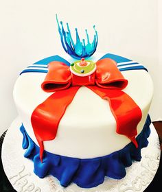 a white cake with red and blue decorations