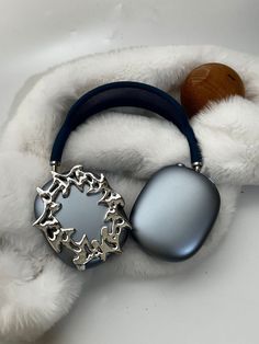 a close up of a headphone on a furry surface