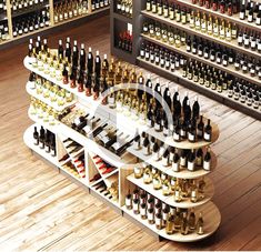 a wine rack filled with lots of bottles on top of a wooden floor next to a wall