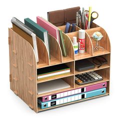 a wooden desk organizer filled with office supplies