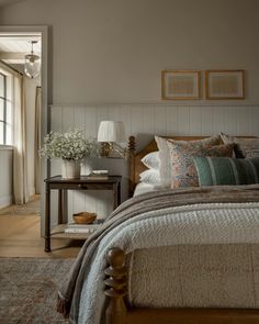 a bedroom with a bed, nightstand and window