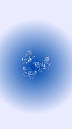 three butterflies flying in the air on a blue background