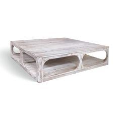 a white wooden coffee table with two shelves on each side and one shelf below it