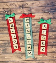 two wooden scrabbles with bows on them that spell out the name nelson rockaway