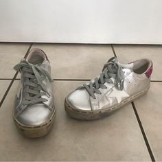 Size 38 And In Great Pre Owned Condition! Small Scuff On Front On Left Shoe (See Picture) Silver Leather Printed Rubber Trim Round-Toes With Glitter Accents Lace-Up Closure At Uppers Golden Goose Silver, Golden Goose Hi Star, Shoes Golden Goose, Star Silver, Metallic Sneakers, Goose Shoes, Golden Goose Shoes, Golden Goose, Printed Leather