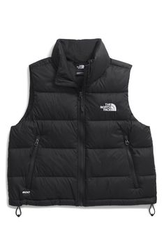 Stay warm throughout the season, whether on the mountain or in the city, in this quilted puffer vest warmed with lightweight 600-fill-power down and finished with durable water repellency. 20 1/2" length (size Medium) Front zip closure Stand collar Side zip pockets 30-denier 45 g/m² ripstop with non-PFC durable water-repellent (non-PFC DWR) finish Lined, with 600-fill-power down fill 100% recycled nylon Machine wash, tumble dry Made in Vietnam PFC/PFAS-free, durable water-repellent coating is fr Black Winter Hiking Vest, Winter Hiking Black Vest, Black Vest For Hiking In Fall, Black Down Vest For Outdoor, Ab Outfits, Nike Puffer Vest, North Face Hydrenalite, North Face Puffer Vest, Northface Puffer