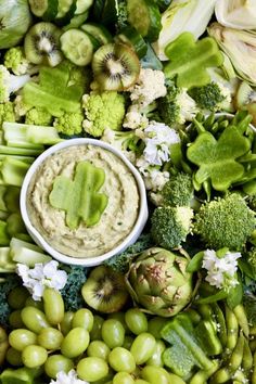 an assortment of fruits and vegetables including broccoli, cauliflower, celery