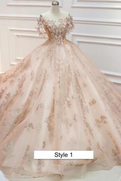 a ball gown on display in front of a white wall