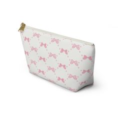 a white and pink bag with bows on it