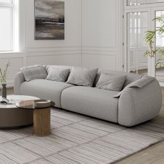 a living room with a large gray couch and coffee table