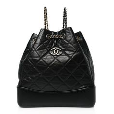 This is an authentic CHANEL Aged Calfskin Quilted Small Gabrielle Backpack in Black. This chic backpack is crafted of diamond quilted aged calfskin leather in black. The shoulder bag features a smooth black leather base, a ruthenium CC logo, ruthenium, aged, polished gold and silver chain threaded leather shoulder straps, and an open-top. This opens to a spacious deep red fabric interior with a patch pocket. High-end Black Quilted Bag, Black Leather Bag With Diamond Quilting, High-end Leather Backpack, Luxury Soft Leather Backpack, Luxury Black Shoulder Bag With Diamond Quilting, Black Diamond Quilted Bag For Everyday Luxury, Evening Leather Backpack With Detachable Strap, Luxury Backpack With Leather Lining, Luxury Black Leather Backpack For Formal Use