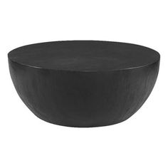 a black bowl sitting on top of a white table