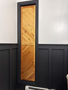 a wooden door in the corner of a room