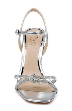 Shimmering jewels embellish the tubular straps and vamp knot on a soirée-ready sandal framed by an angular square toe and tapered flare heel. 4 1/2" heel (size 8.5) Adjustable ankle strap with buckle closure Textile upper/synthetic lining/rubber sole Imported Bridesmaid Heels Silver, Bridesmaid Things, Bridesmaids Heels, Cold Weather Shoes, Jewel Badgley Mischka, Fall Wardrobe Essentials, Modern Shoes, Strap Sandals Women, Sneaker Jewelry