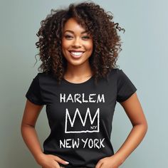 HARLEM T-shirt, New York Harlem Manhattan Unisex Shirt, New York Crown Tee, Manhattan N.Y. Shirt, Harlem New York City borough ▼ BELLA CANVAS T SHIRT: ＊Fit True to size. ＊Please not that these shirts are unisex size. ＊The best thing to figure out you exact size is to look at the Bella Canvas size Chart measurements. ▼ MATERIAL & FEATURES: ＊ 100% Airlume combed and ringspun cotton (fiber content may vary for different colors) ＊ Light fabric (4.2 oz/yd² (142 g/m ▼CARE INSTRUCTIONS: Machine wash: warm (max 40C or 105F); Non-chlorine: bleach as needed; Tumble dry: low heat; Iron, steam or dry: medium heat; Do not dryclean. ▼ PRODUCTION & SHIPPING TIME ＊Each shirt is made to order. ＊Production time : 2-7 business days (Excluding weekends, holidays) ＊US Shipping time : 3-6 business days ＊If you Urban Fitted T-shirt With Letter Print, Urban Adventures Graphic Tee With Short Sleeves, New York Pride, East Harlem, Harlem New York, Manhattan Ny, How To Show Love, Look Plus, Empire State