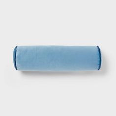 a blue rolled up pillow on a white background with the word,'i love to sleep