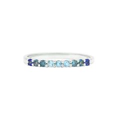 Nine gorgeous semi-precious & precious stones exude flawlessness in this 14K gold ring. The gemstones are set to create a tone-on-tone stream of color that feels subdued, yet vibrant. This is 0.3 Ct and comprised of 14K solid gold. Blue Gemstone Eternity Band In Fine Jewelry Style, Blue Diamond Multi-stone Birthstone Ring, Blue Multi-stone Diamond Birthstone Ring, Blue Multi-stone Emerald Ring For Anniversary, Blue Topaz Half Eternity Ring, Sapphire Multi-stone Topaz Promise Ring, Green Multi-stone Emerald Promise Ring, Blue Multi-stone Emerald Ring For Promise, Blue Topaz Rings With Gemstone Accents