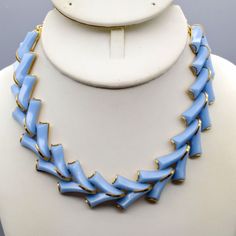 Vintage Blue Chevron Choker Necklace, Pastel Lucite Arrows in Gold Tone Eloxal Chain Measurement * 13-15.5" unsigned hook clasp Condition * Excellent condition. Gently used. Size: Womens 13-15.5" Condition: Pre-Owned Good Blue Costume Jewelry Necklaces With Lobster Clasp, Blue Chain Costume Jewelry, Blue Costume Jewelry Necklace With Chain, Blue Costume Jewelry With Chain, Vintage Blue Chain Jewelry, Vintage Blue Jewelry With Chain, Blue Metal Jewelry With Lobster Clasp, Blue Chevron, Hook Clasp