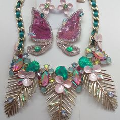 15" Wide Chain Necklace With Interwoven Teal Satin Ribbon. 3 1-3/4" Gold Fronds Decorated With Pale Pink Flowers With Rhinestone Centers & Multi-Colored & Shaped Stones. Embellishments Comprise 6" Of Necklace. Lobster Claw, Betsey Heart, & 3" Extender. Retail - $125. 7/8" 4 Curved Petal Flower Of Pale Pink With Blue Rhinestone Center Suspends Rhinestone-Outlined Lavender Winged Butterfly With Accent Rhinestones. Butterfly Is 2-1/2" X 1-1/4". Drop Is 3". Studs. Retail - $58. Nwt Pink Jeweled Jewelry Sets For Party, Pink Necklaces With Matching Earrings For Party, Pink Flower Necklace, Pale Pink Flowers, 15 Necklace, Petal Flower, Betsey Johnson Jewelry, Pretty Stuff, Lovely Jewellery