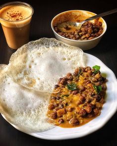 an omelet and some other food on a plate next to a cup of coffee