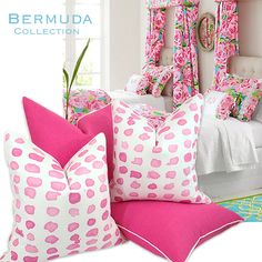 pink and white pillows on a bed in front of a window with the word bermudi