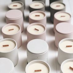 many white candles with brown sticks in them