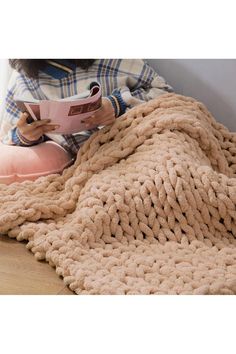 This handmade chunky knit throw is perfect for anyone who is both stylish and practical. The throw is very soft and has incredible comfort, giving you a cloud-like touch experience! Use it in the living room to curl up with your favorite novel and a cup of tea, or drape it over the back of an armchair for a casual look. Brimming with versatile style, this must-have throw blanket offers an extra cozy layer to any corner of your home. Chunky Knit Throw Blanket, Chunky Knit Throw, Knit Throw, Knit Throw Blanket, Favorite Novels, Oasis Fashion, A Cup Of Tea, Knitted Throws, Cup Of Tea