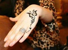 a woman's hand with a tattoo on it