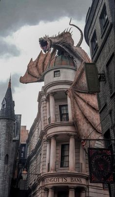 a dragon statue on top of a building